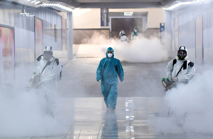Volunteers in protective suits disinfect a railway station as the country is hit by an outbreak of the new coronavirus, in Changsha, Hunan province, China February 4, 2020. cnsphoto via REUTERS ATTENTION EDITORS - THIS IMAGE WAS PROVIDED BY A THIRD PARTY. CHINA OUT. TPX IMAGES OF THE DAY